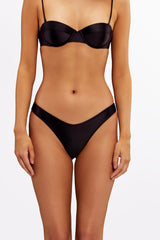 Close-up of brushed gold hardware on Nero Gloss Brazilian bikini bottom.
