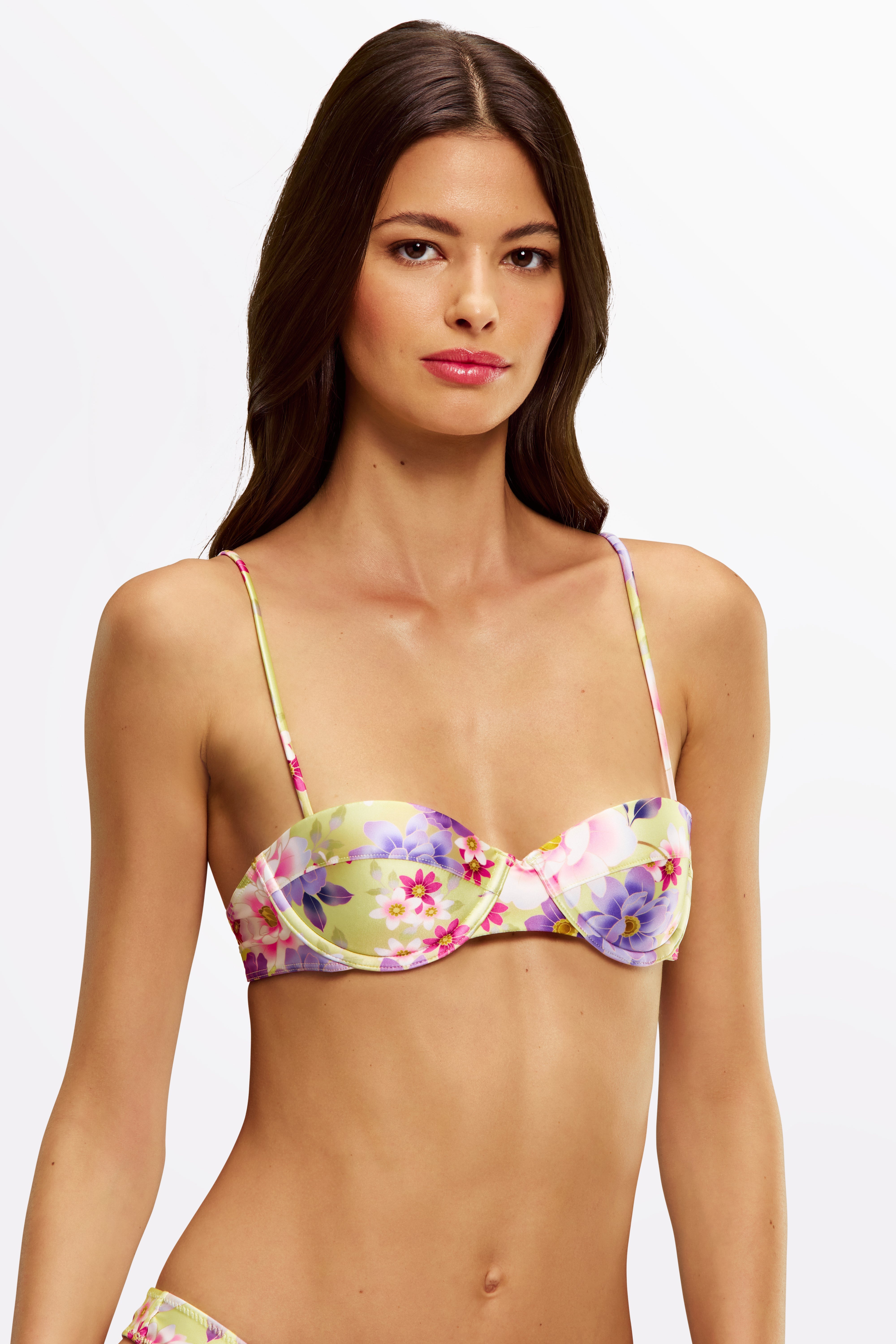 Close-up of Jaci Flor du Sol bikini top with hand-drawn print and gold hardware.